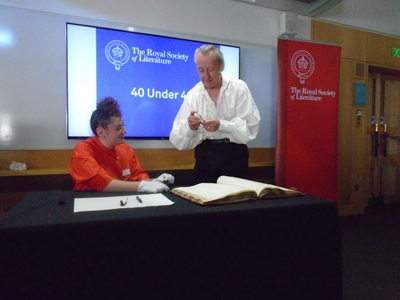 Bryan about to sign the roll at the Royal Society of Literature in a proper Big Shirt!