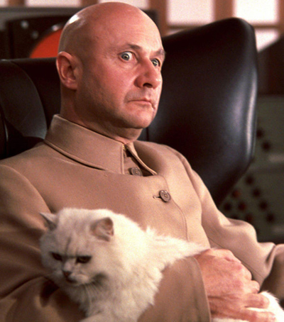 My depiction of Aristotle Krapaud here is definitely referencing the famous Bond villain Ernst Stavro Blofeld, who’s usually seen stroking his cat. He appears in several of the novels and films. Here’s Donald Pleasance in the role.