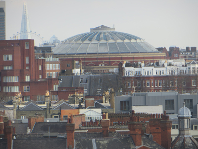 Seen here, in the background, and also in panel 6 on the next page is the Albert Hall, as seen from the Kensington Roof Gardens.